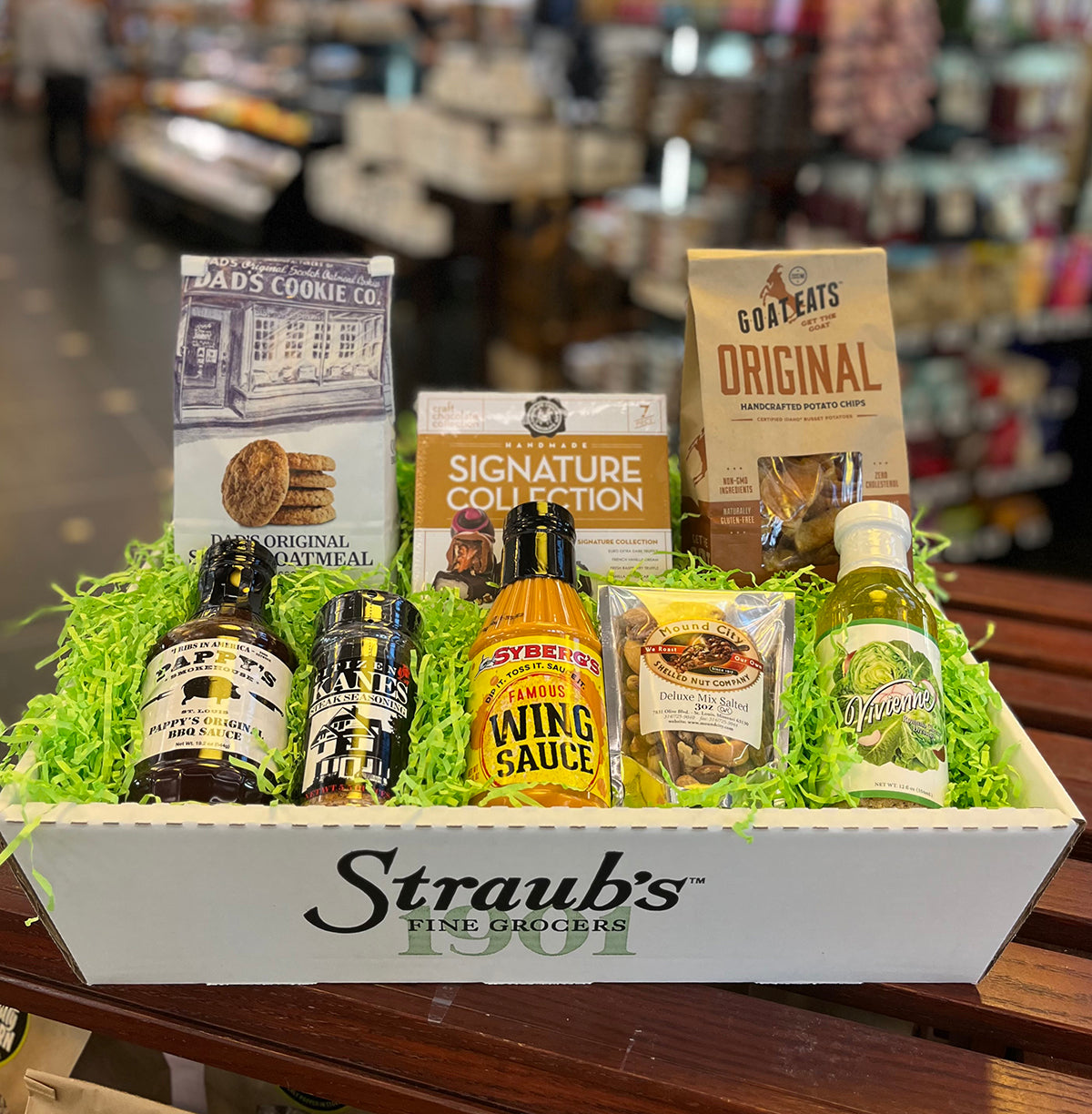 Gift basket with Straub's products in a store setting