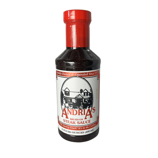 Bottle of Andria's Steak Sauce with a red cap on a white background
