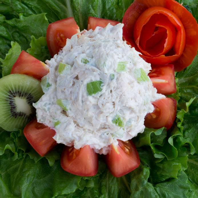 Chicken Salad on a bed of lettuce.